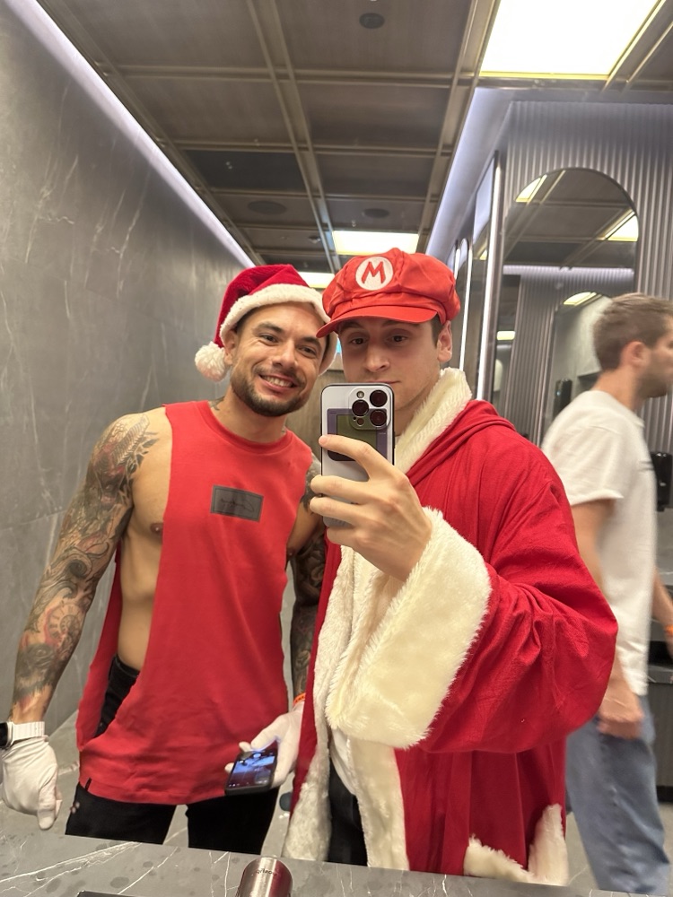 Swapping a mario hat with a santa hat at a party