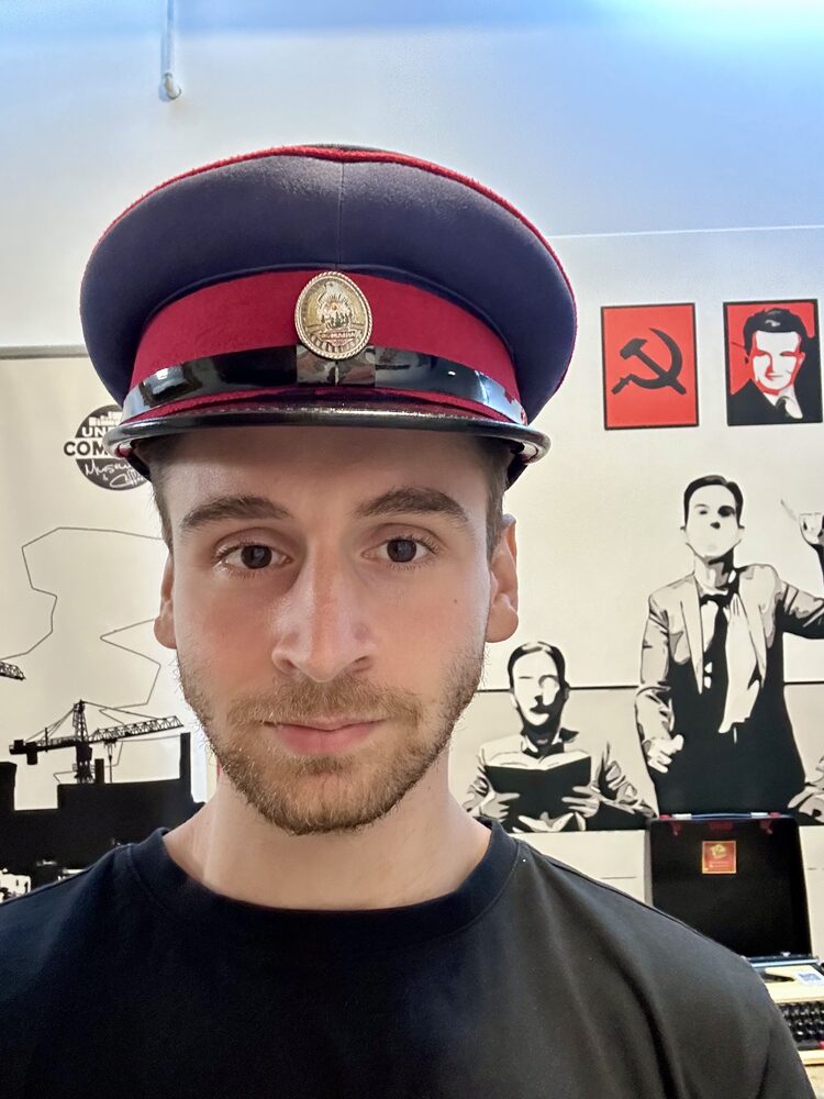 A peaked cap, in appropriate company